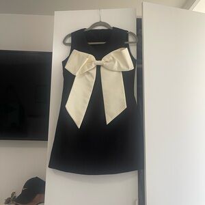 Elegant Black and Cream Mini Dress with Bow